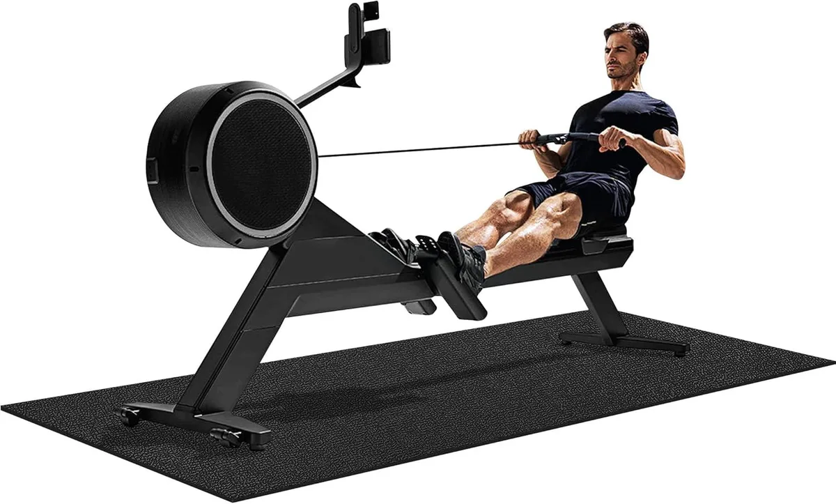 Black rectangular treadmill mat 96 by 36 inches on floor