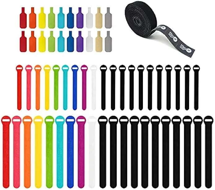 Black hook-and-loop cable ties, labels and a perforated roll on a white background