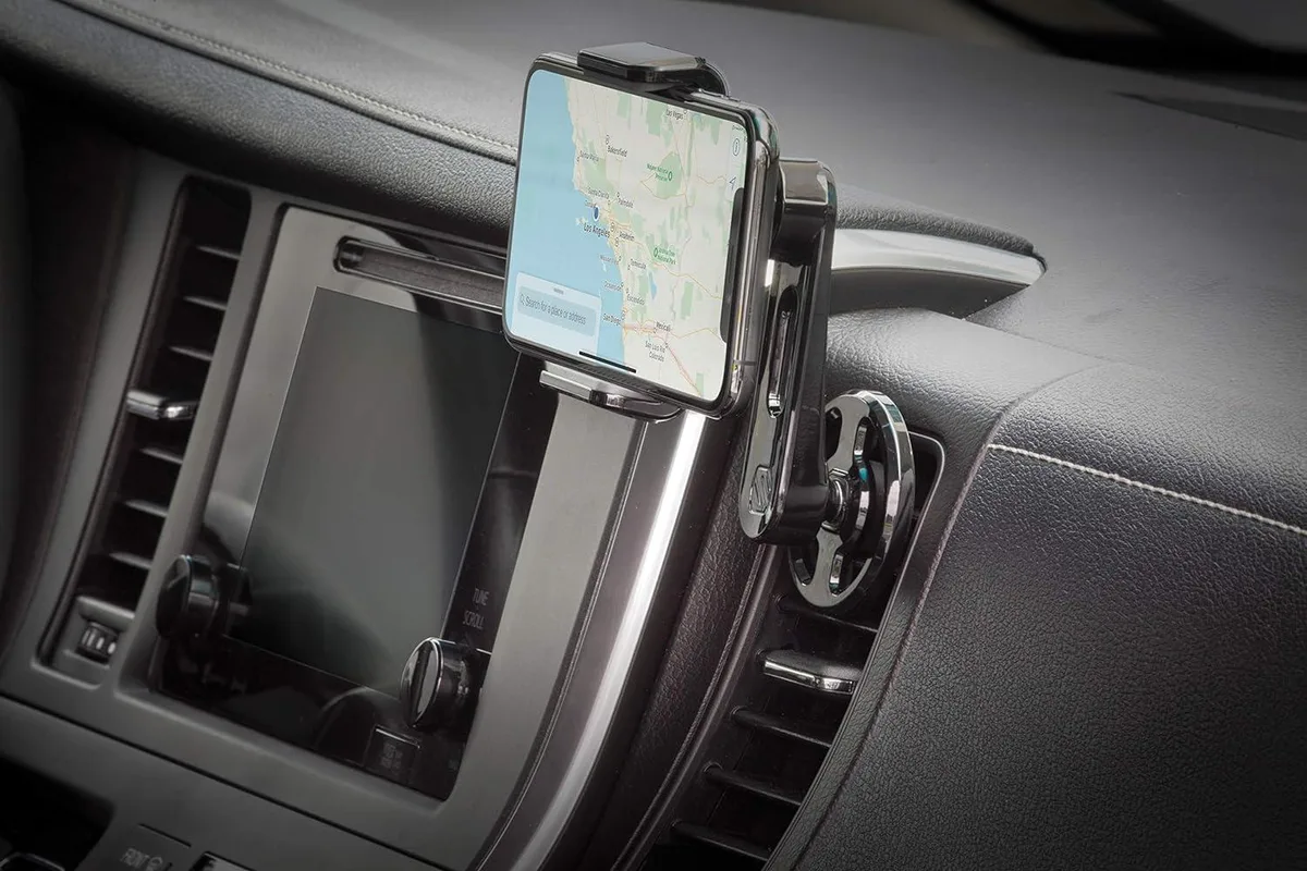 Black plastic vent clip phone holder with adjustable arms and rotating ball joint