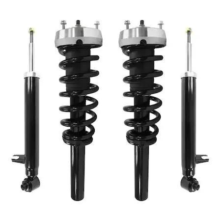 Four silver strut assemblies and two shock absorbers on grey background