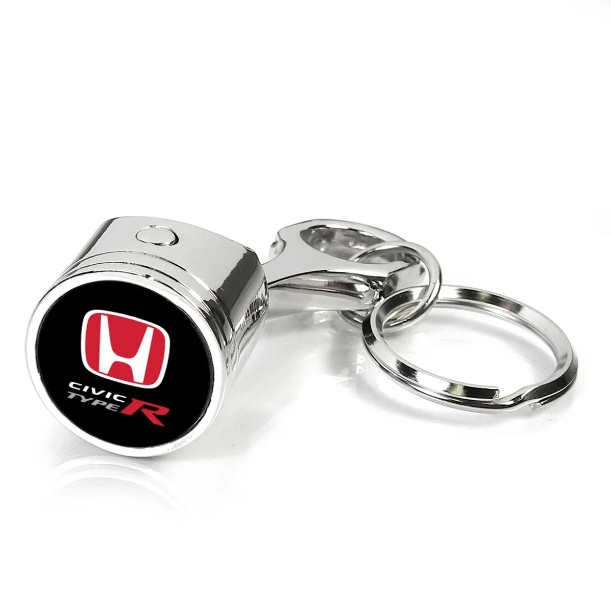 Chrome-finish metal piston and rod key chain with red Honda logo dome