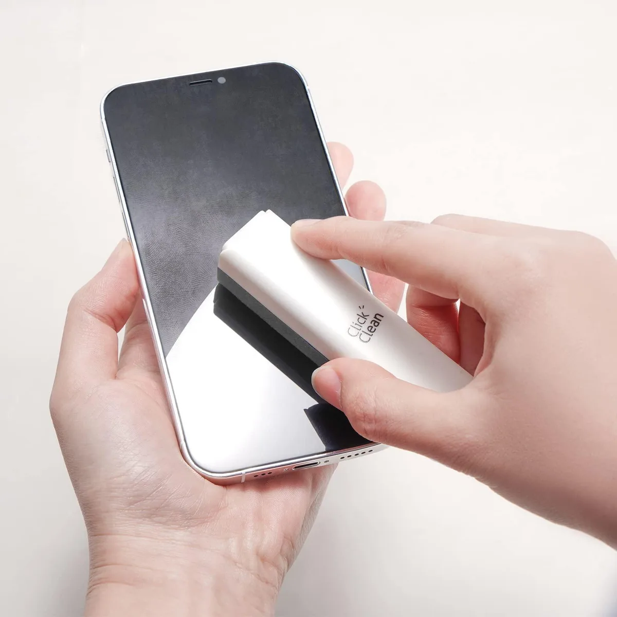 White spray bottle with grey microfibre cloth and fold-out phone stand