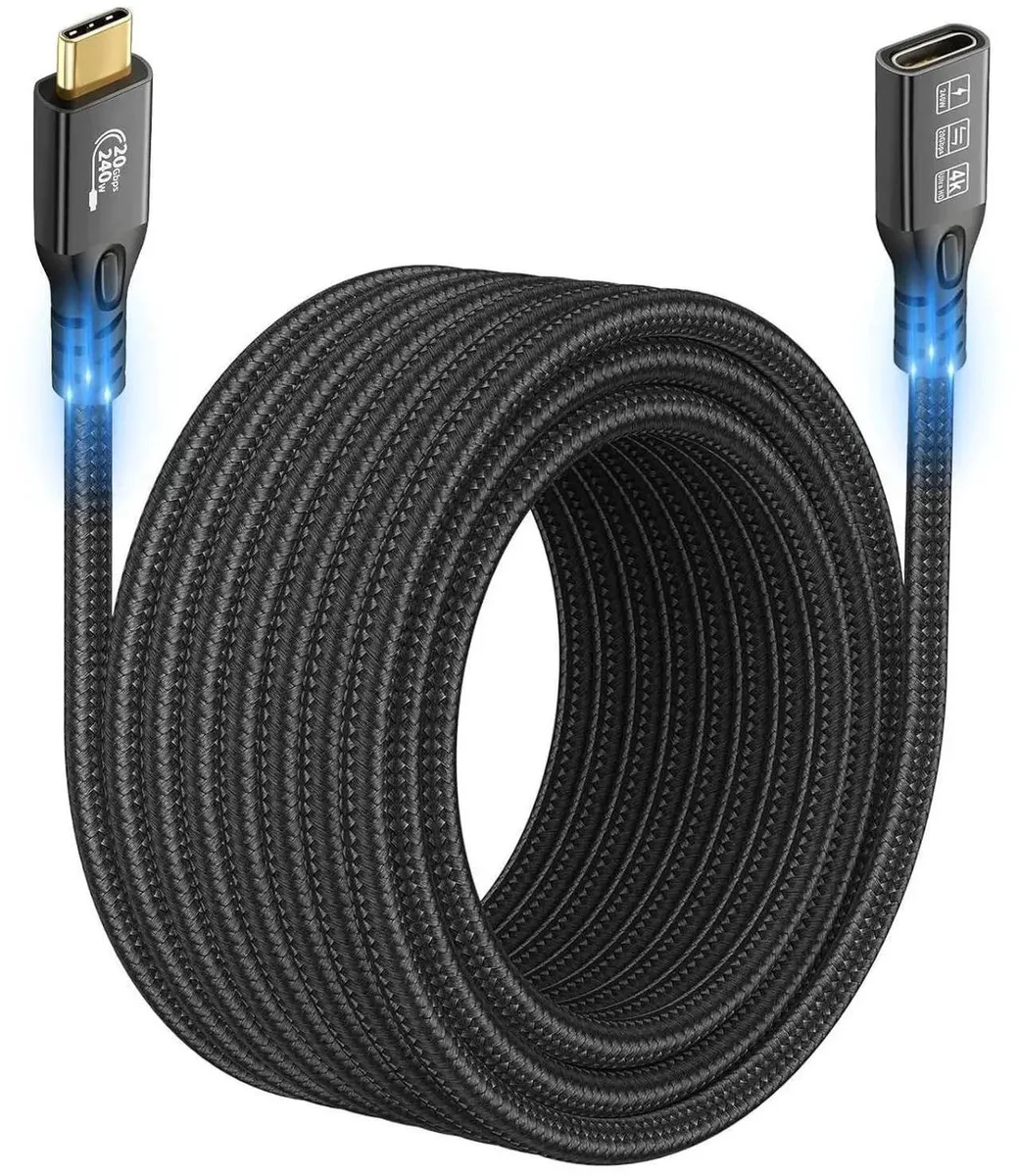 Long black USB-C male to female extension cable coiled on white surface