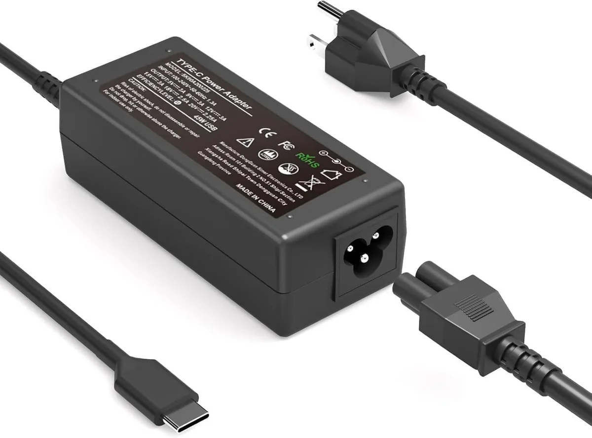 Compact black USB-C laptop charger with fixed cable and plug prongs