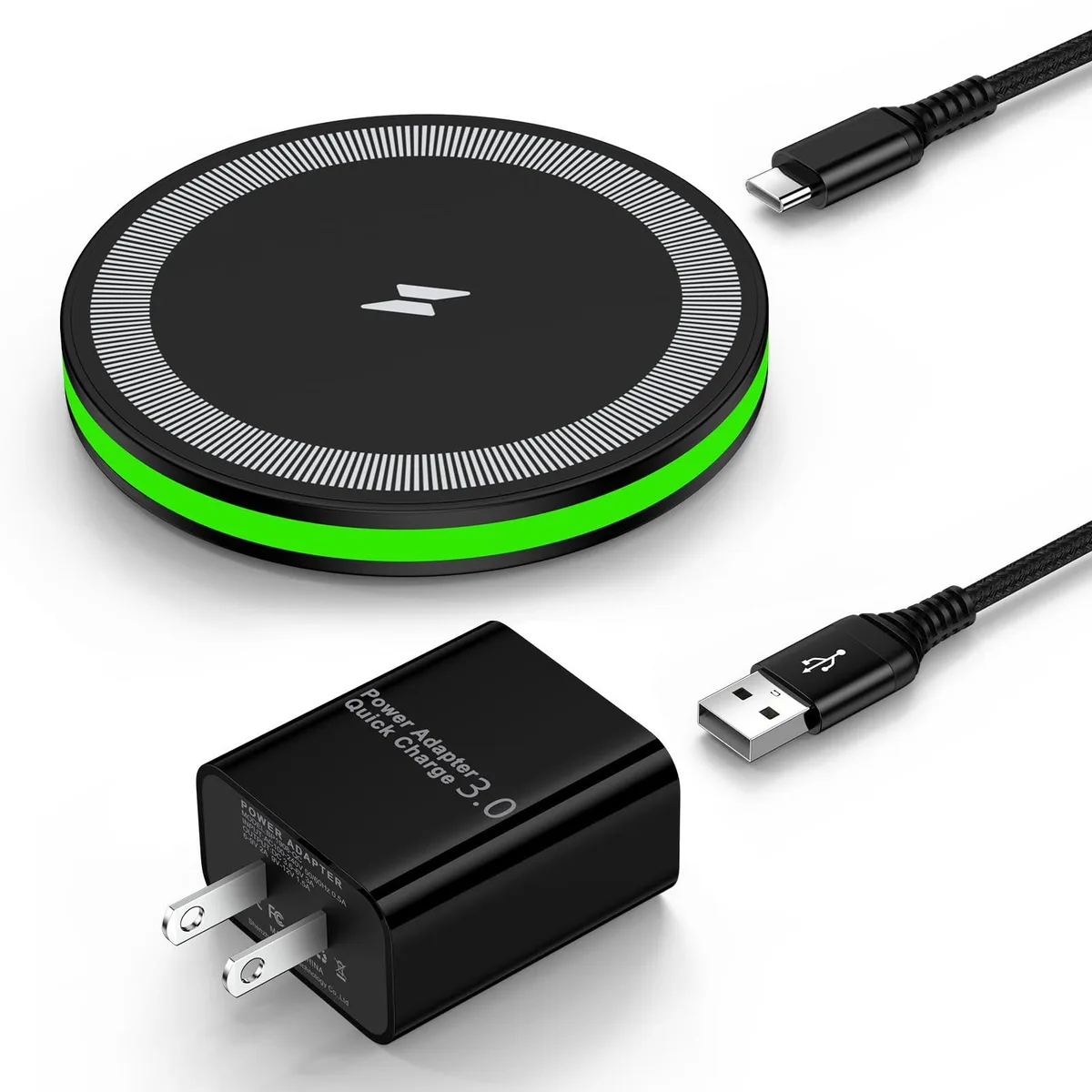 A flat circular charging pad in matte black with a subtle LED ring and a USB-C cable attached