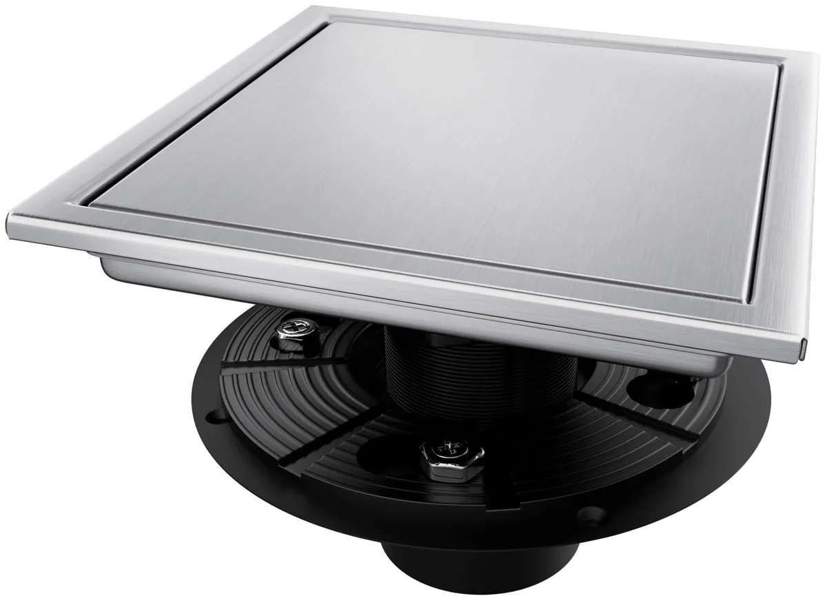 Twelve square stainless steel shower drains with flange and tile-insert covers