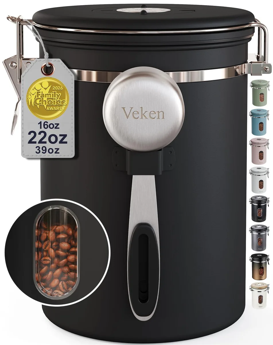 Black cylindrical canister with clear window and stainless steel lid, 5.3 by 7.48 inches
