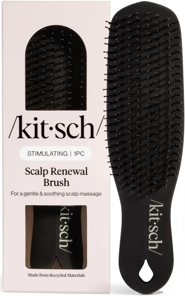 Black scalp renewal brush with flexible bristles and looped handle