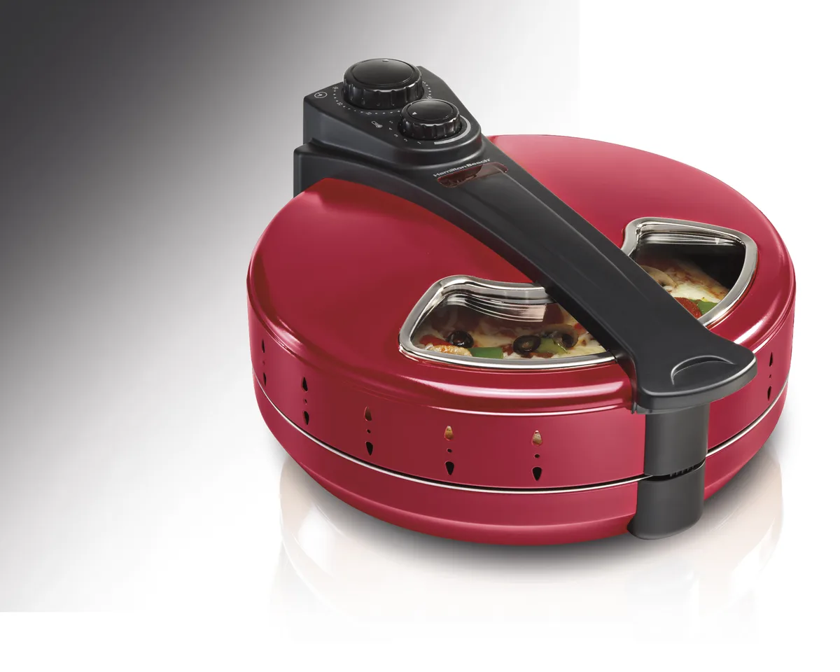 Red Hamilton Beach pizza maker with viewing window and rotating pan