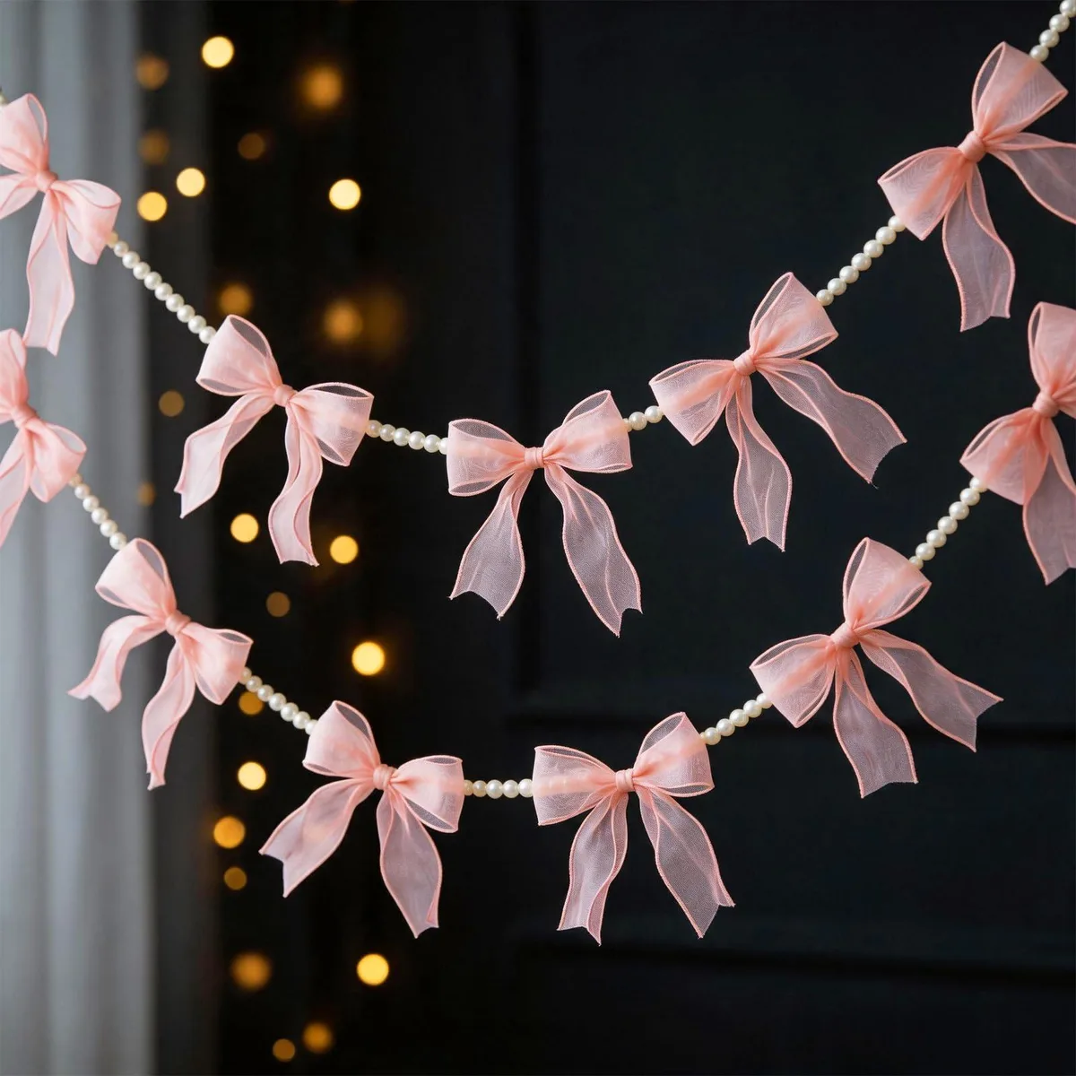Two pink tulle bow garlands with faux pearl chains, each 6.6 ft long, six bows per strand