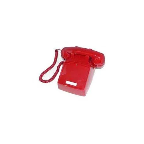 Red ITT 2500 corded desk telephone with handset and coiled cord