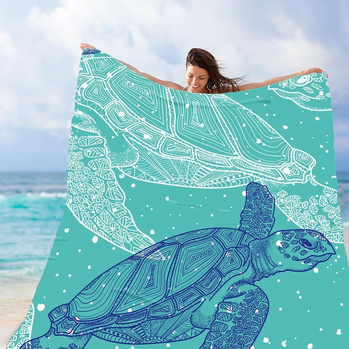 Large rectangular waterproof picnic blanket folded into mesh carry bag with carabiner