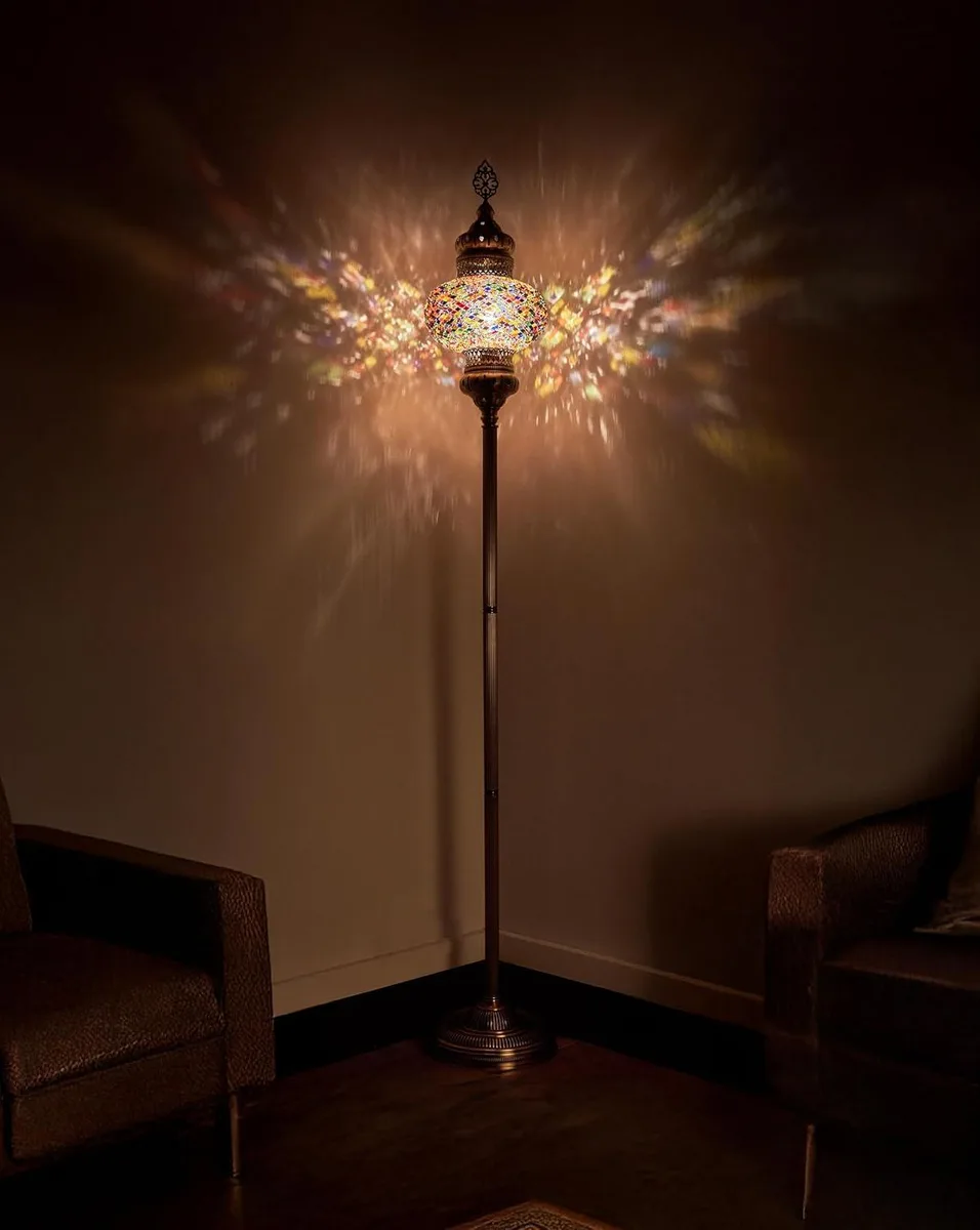 Tall floor lamp with 10 inch mosaic glass globe in multicolored pieces on antique brass metal base