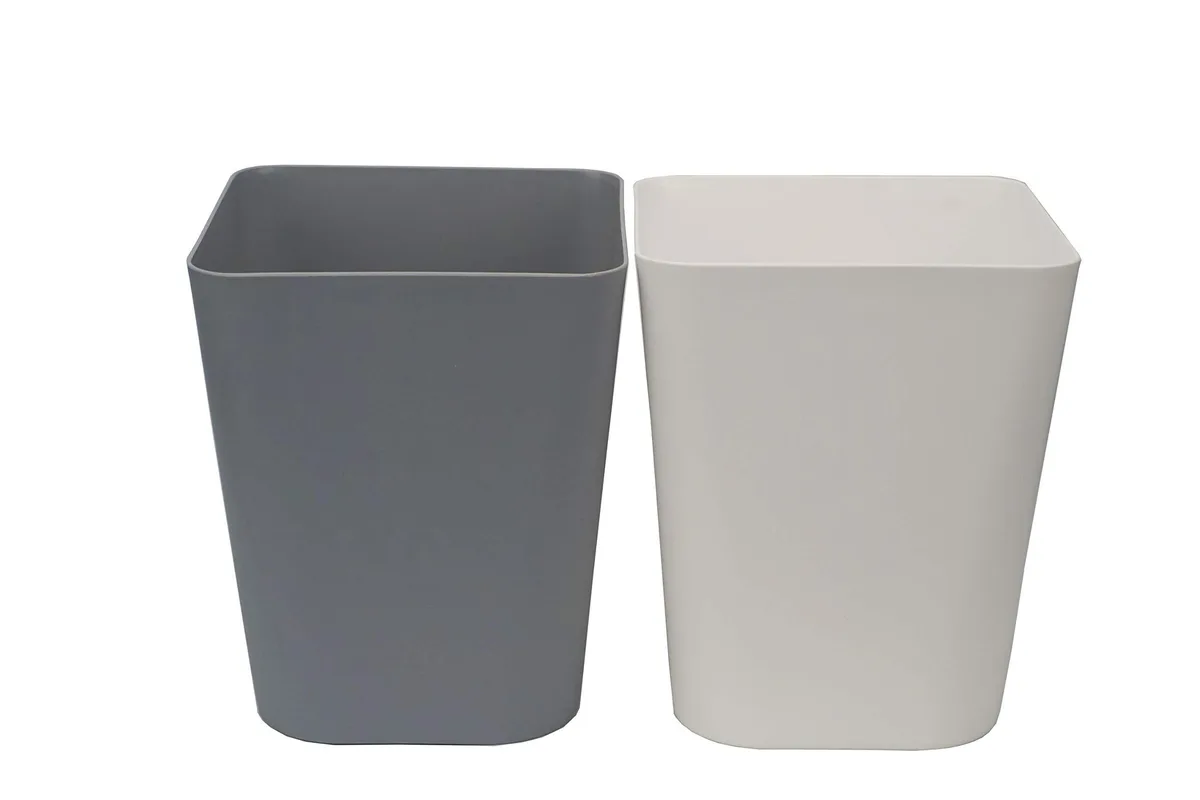 Twelve small square gray polypropylene bins with open tops