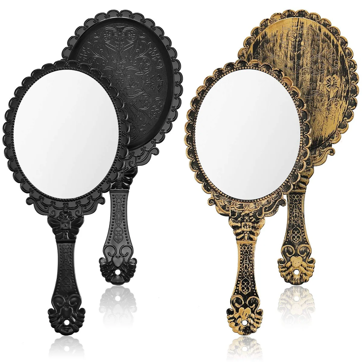 Two oval handheld mirrors with black and bronze plastic frames, embossed floral details, and handles