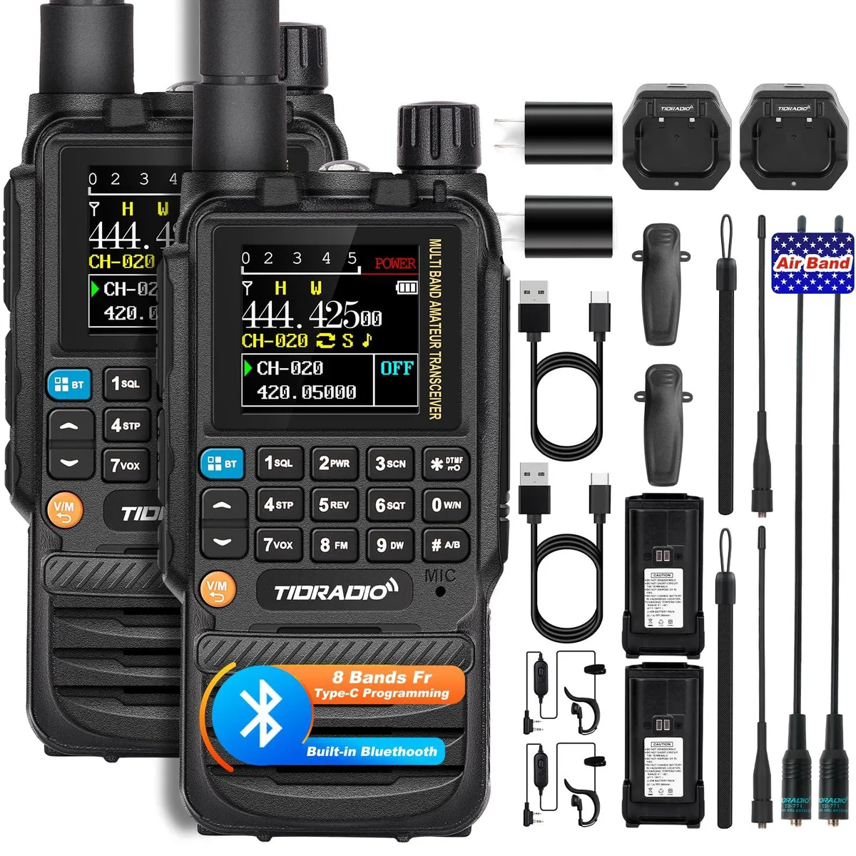 Two compact handheld radios with antennas, colour screens and USB-C ports, shown with batteries, earpieces and chargers