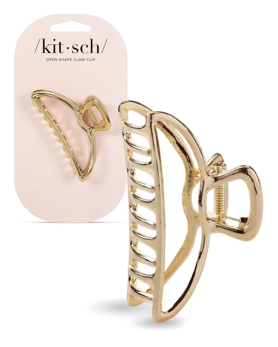 Gold metal claw hair clip with bow detail, open arch shape, polished finish