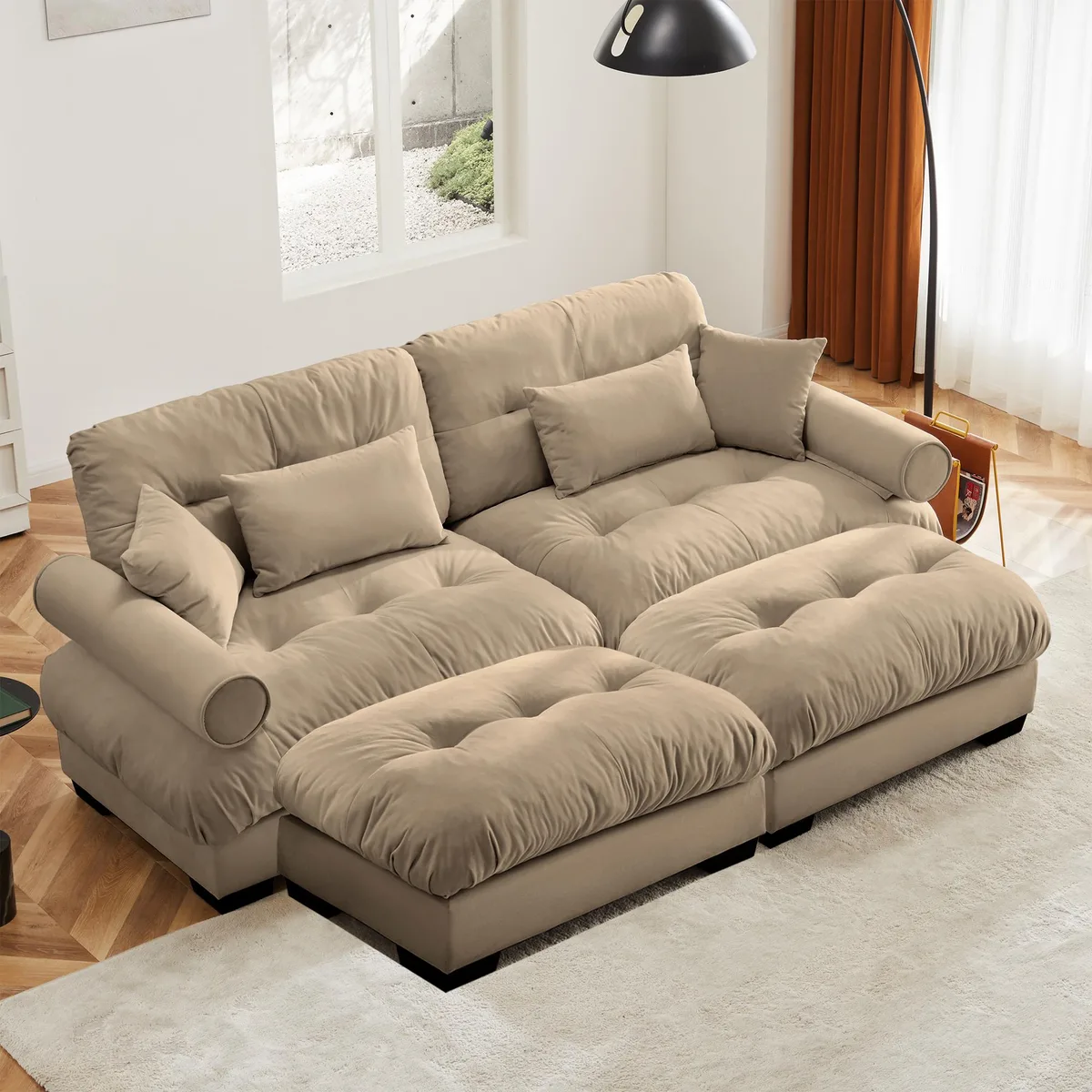 Camel velvet two-seater sofa with matching ottoman, round bolster armrests, throw and waist pillows