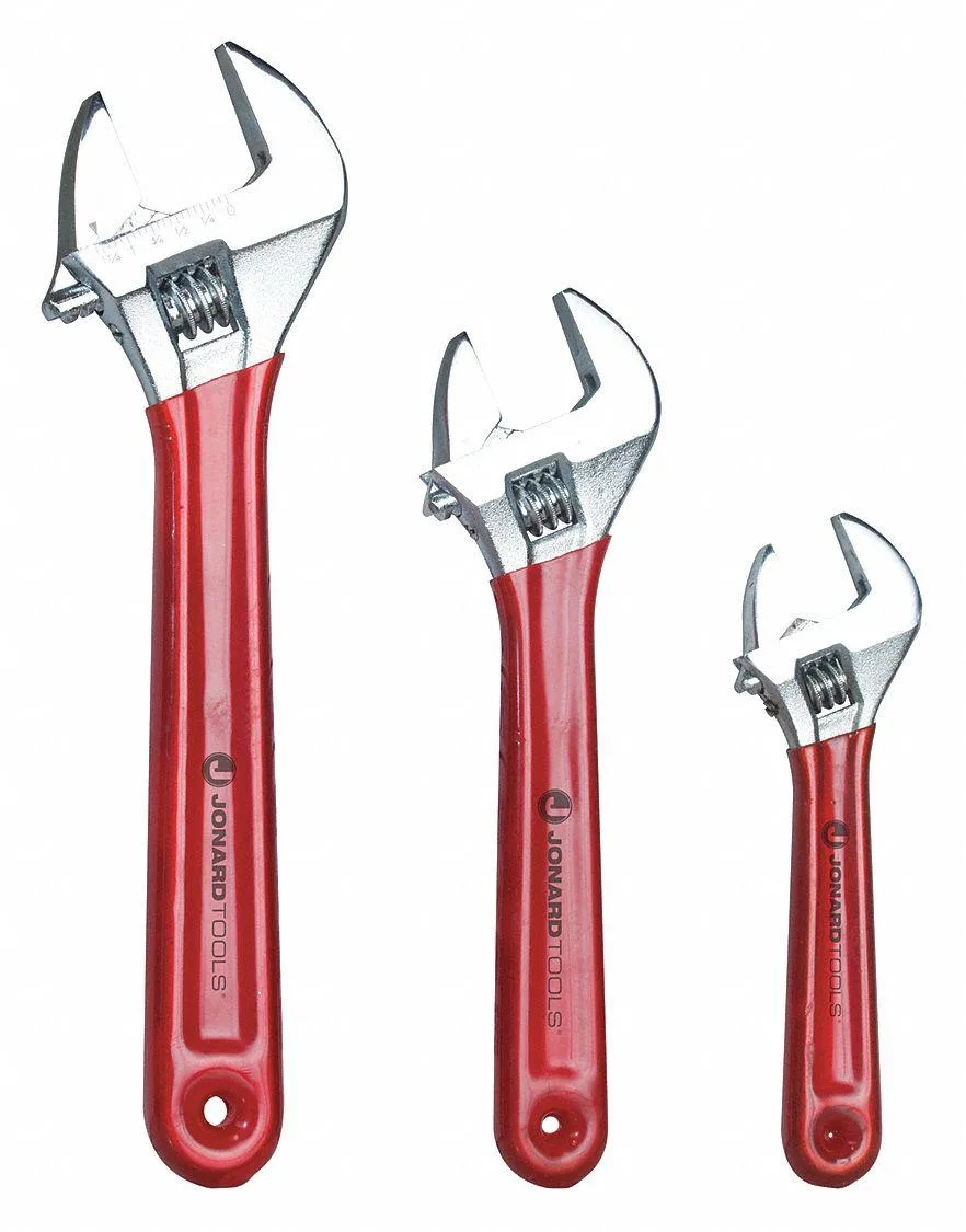 Three chrome adjustable wrenches with vinyl grips, six to ten inches