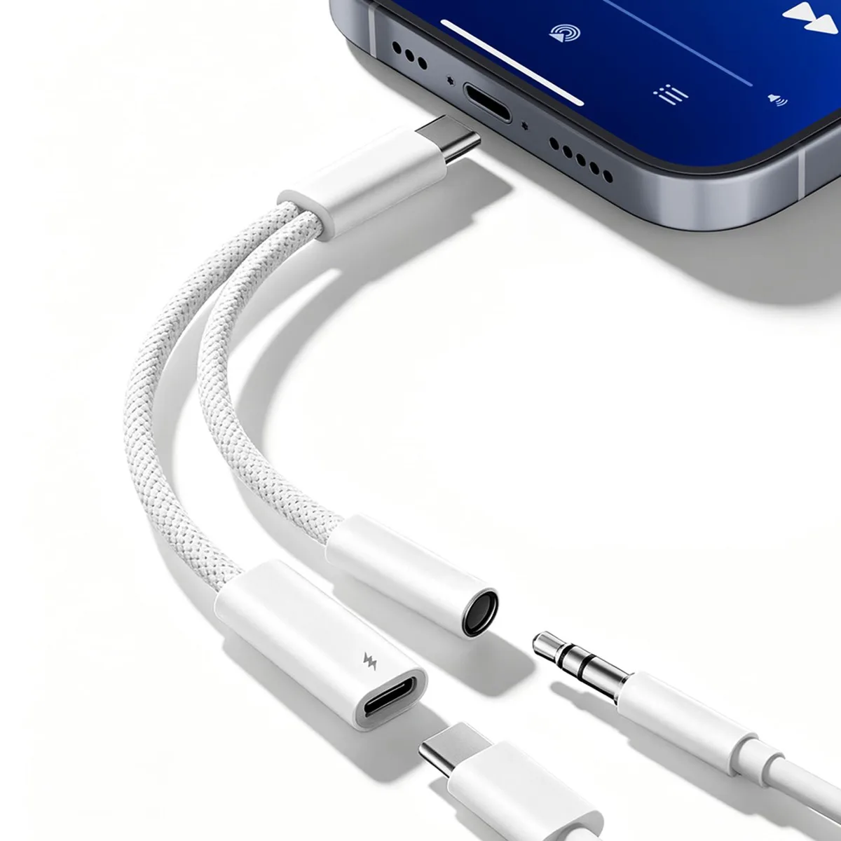 White USB-C dongle with 3.5 mm jack and USB-C charging port, braided cable