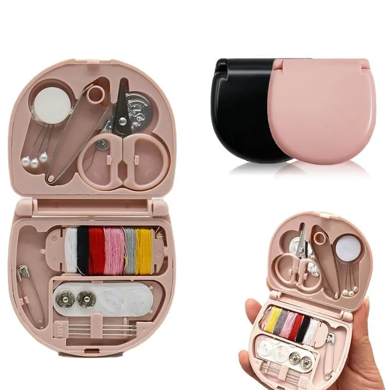 Two small rectangular sewing cases, one black and one pink, each with organized compartments and tools visible