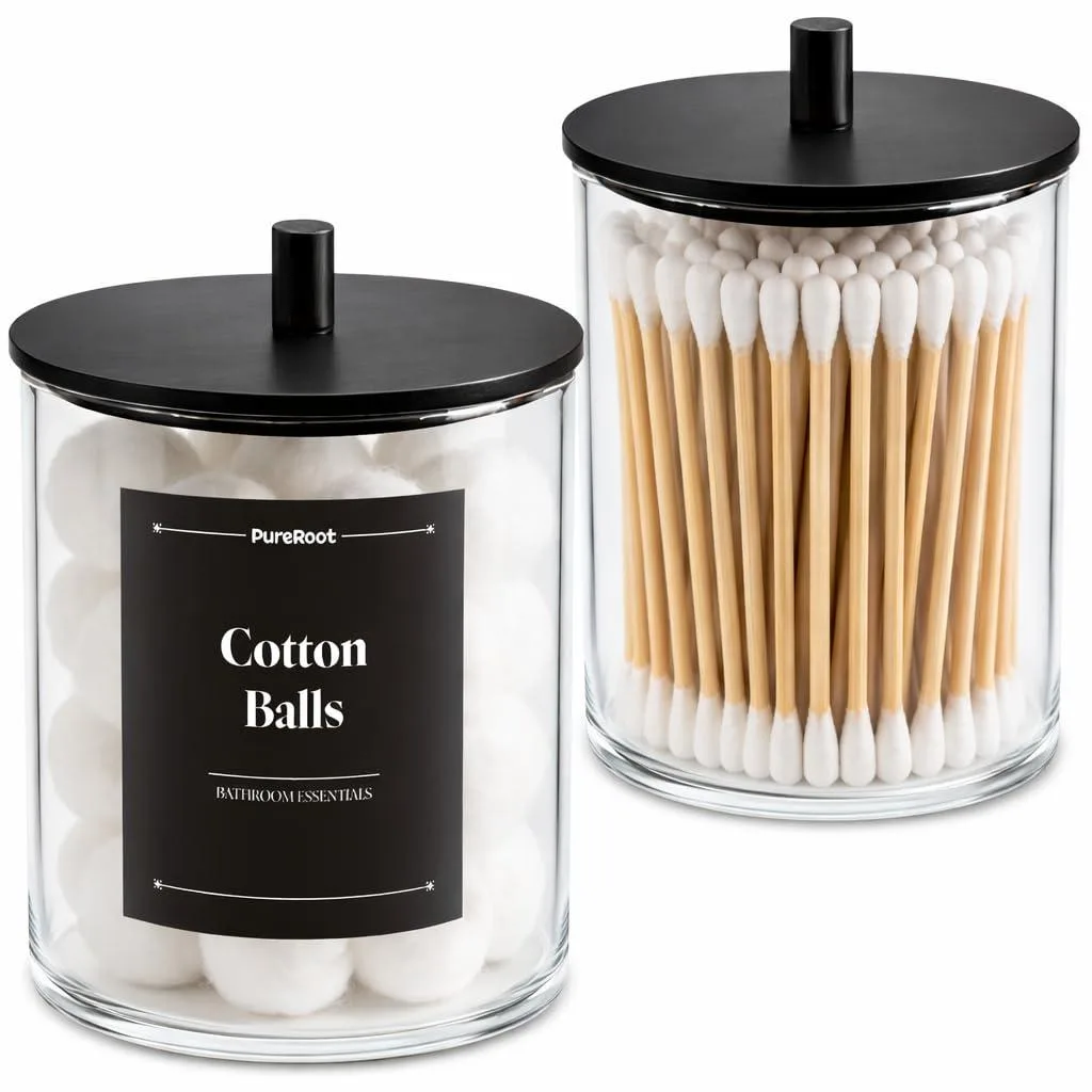 Two clear glass apothecary jars with black wooden lids, 10oz and 15oz sizes