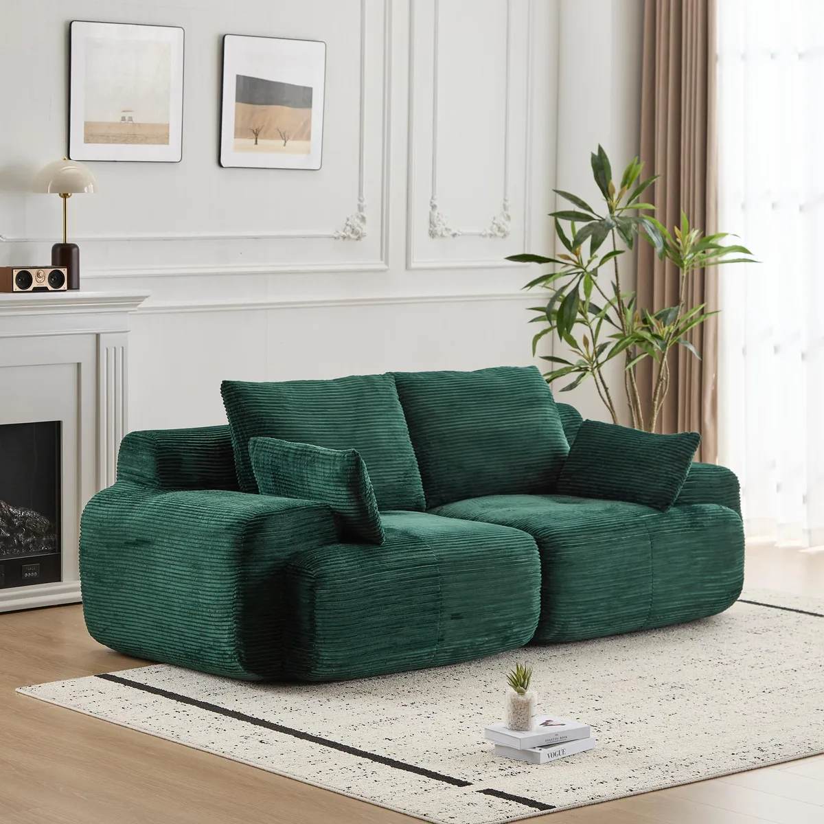 Green corduroy two-seat sectional sofa with deep cushions and scatter pillows
