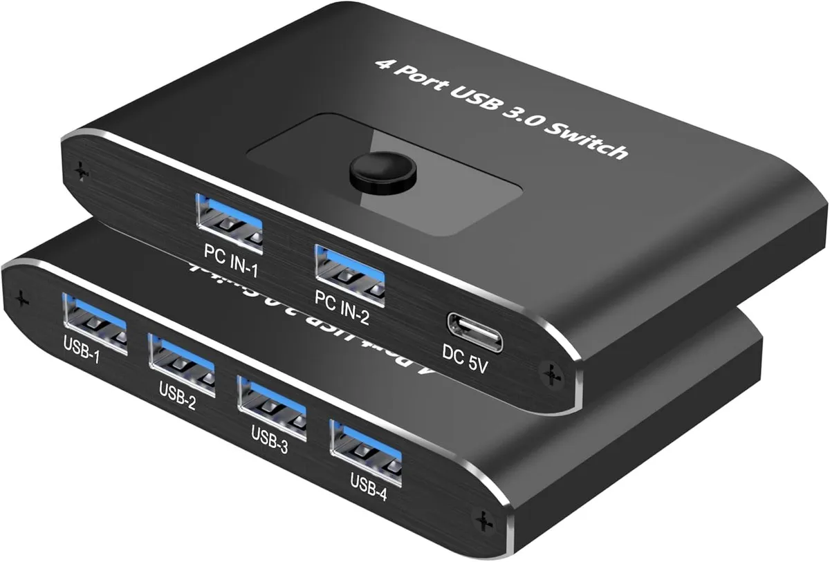 Compact aluminum USB 3.0 KVM switch with two push buttons and LED indicators, four peripheral ports