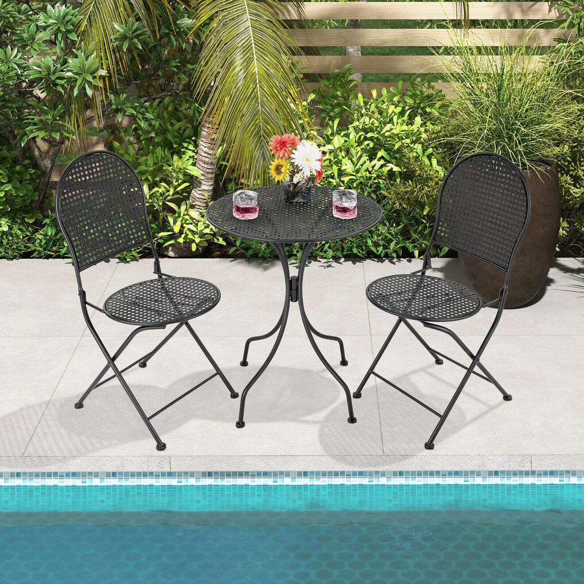 Black folding bistro set with two chairs and a small table, rattan-look seats, metal frames