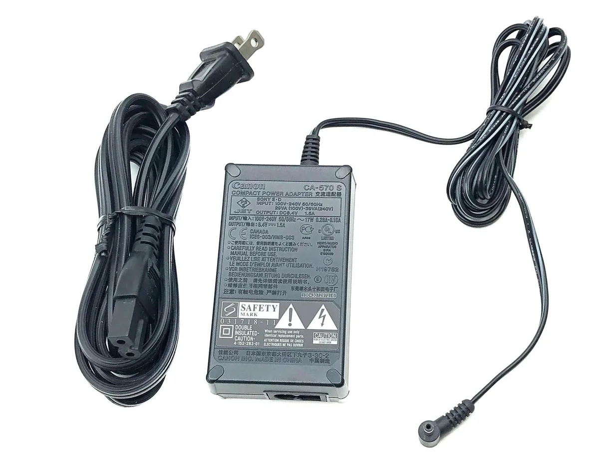 Compact black Canon CA-570 S power adapter with detachable mains cord
