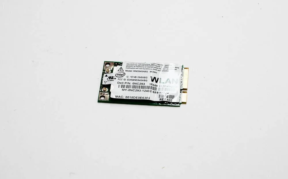 Small rectangular green circuit board with gold edge connector and black antenna ports