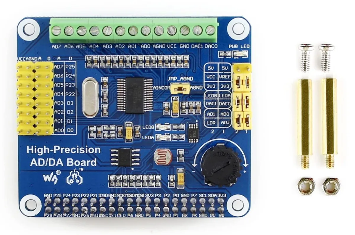Green rectangular circuit board with 40 pin header, black chips and silver screw terminals