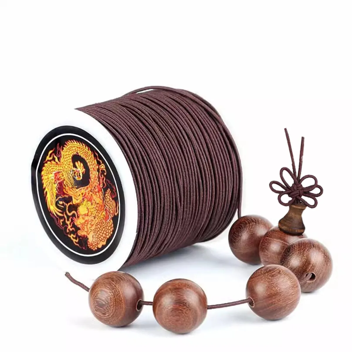 Brown elastic beading cord on spool with hook needle tools