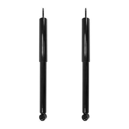 Two silver rear shock absorbers in a cardboard box