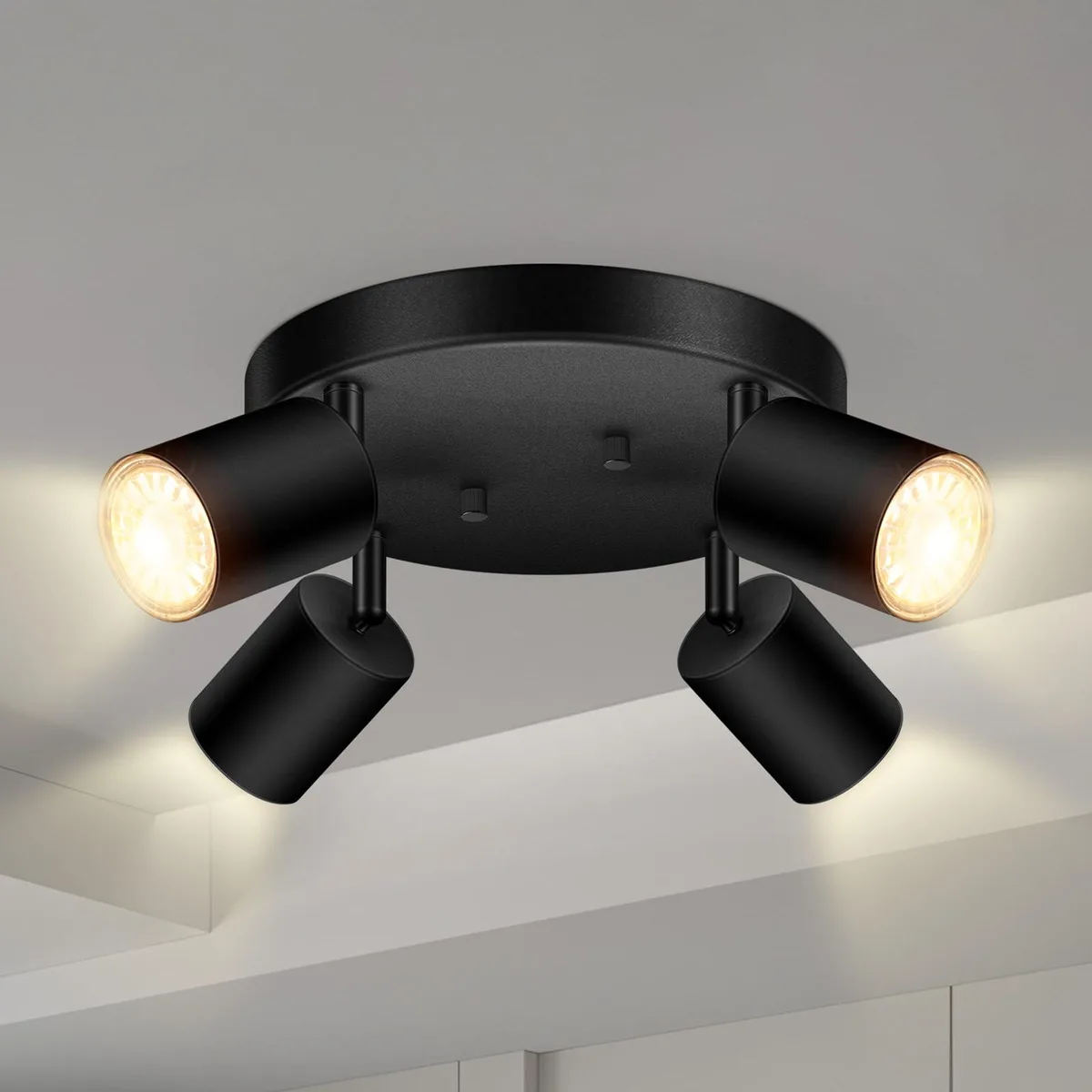 Matte black four-head track light kit, adjustable round spotlights, GU10 base, metal construction
