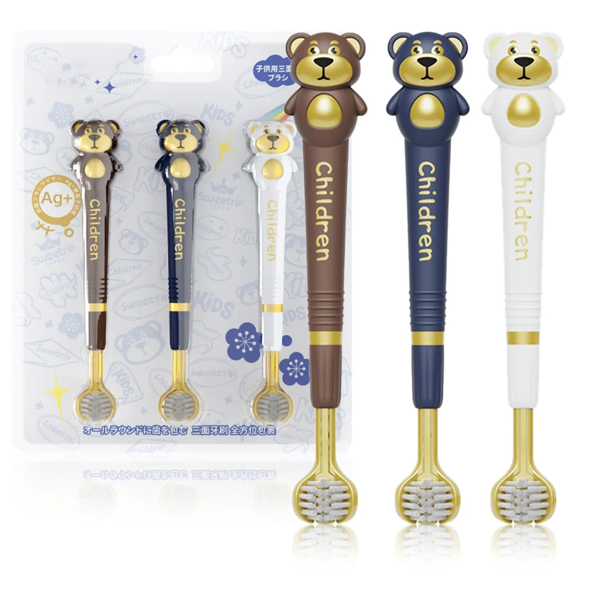 Three white kids manual toothbrushes with cartoon bear handles and triple-sided brush heads