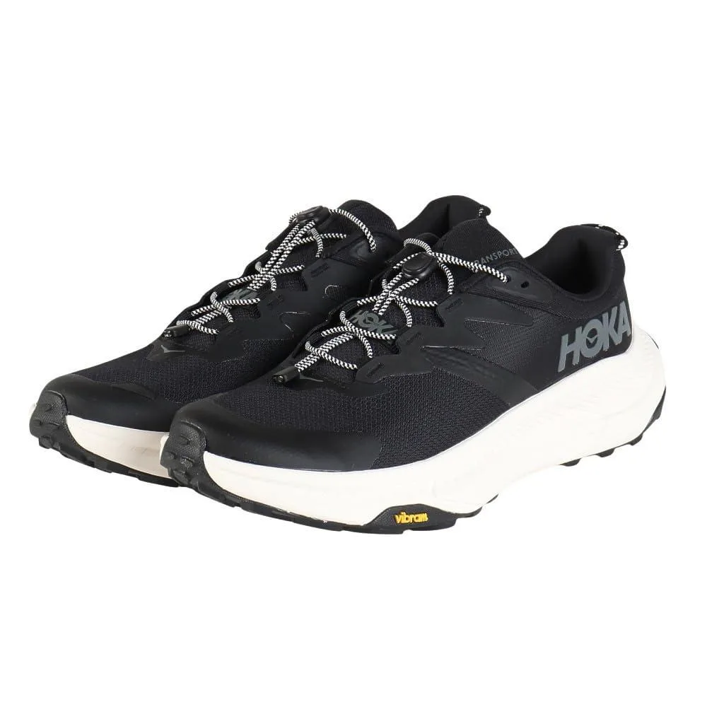 Black and alabaster HOKA Transport sneaker with textile and synthetic upper, quick-toggle laces, reflective details, size 9