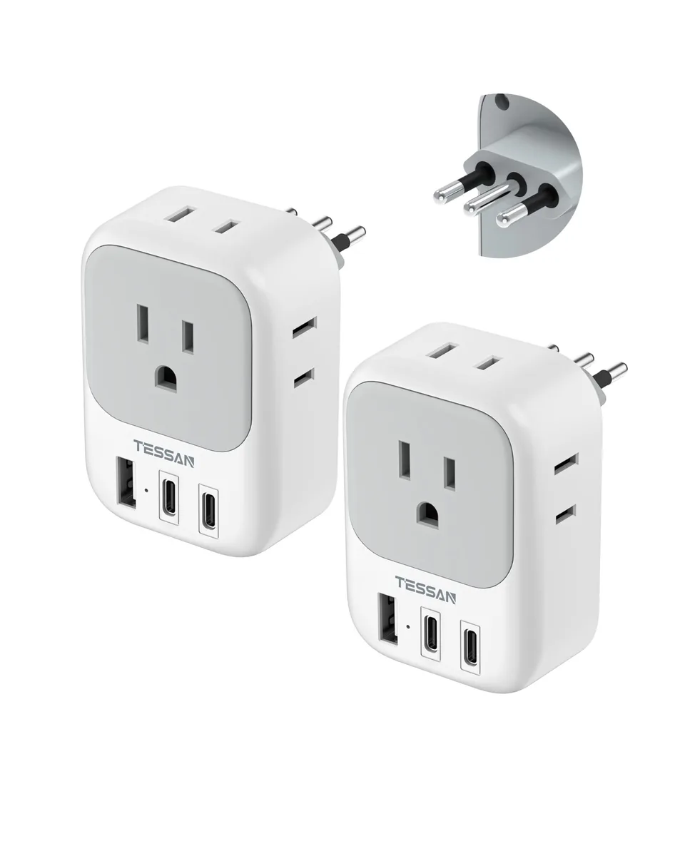 White and grey rectangular Type L travel adapter with four AC outlets and three USB ports
