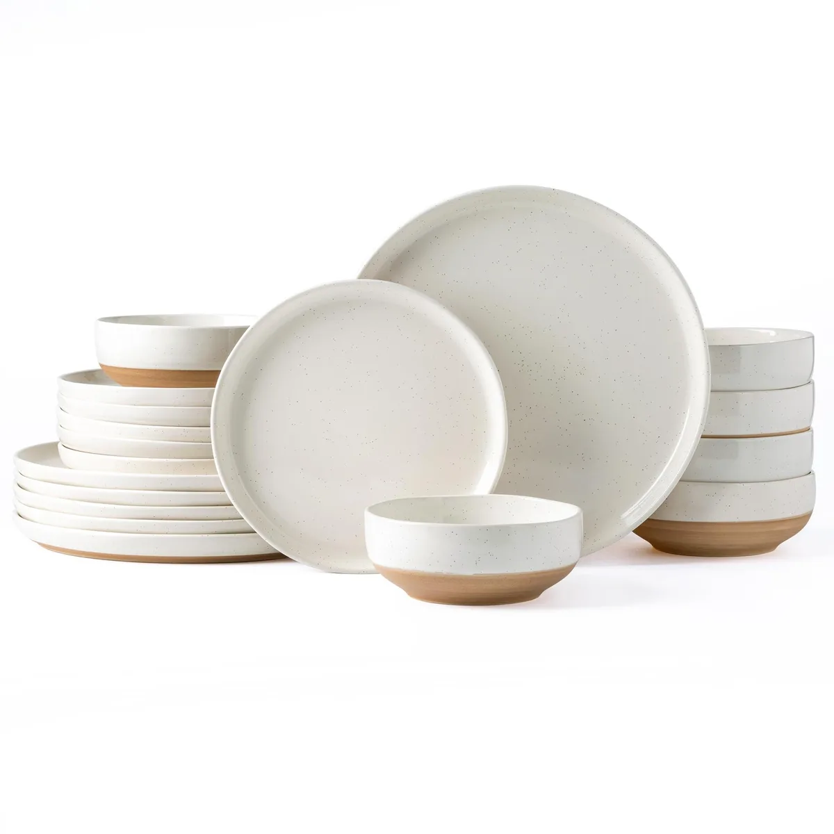 Eighteen-piece stoneware dinner set in light beige with glossy finish and wavy rims