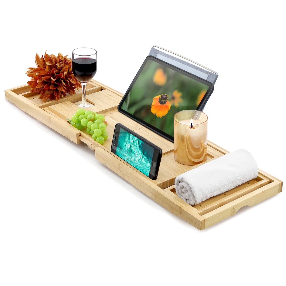 Light bamboo bath tray with expandable arms and cut-out slots for devices and glass