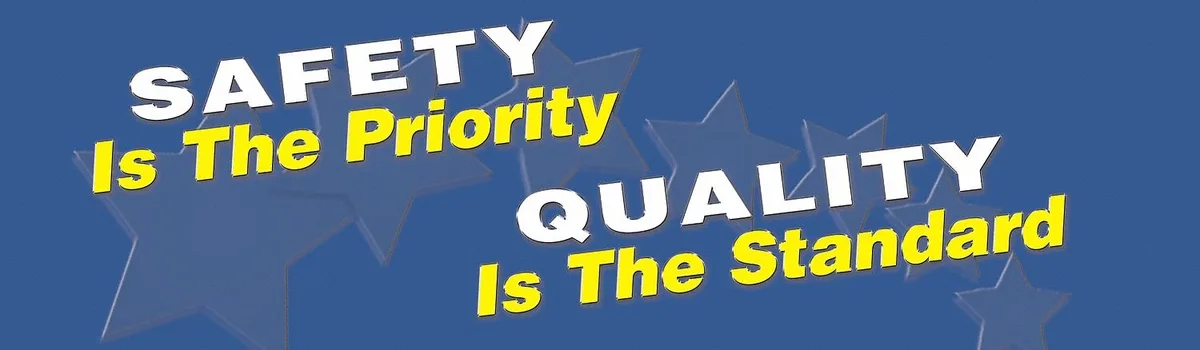 Blue horizontal rectangular safety banner with white text and symbol reading Safety Is The Priority Quality Is The Standard measuring