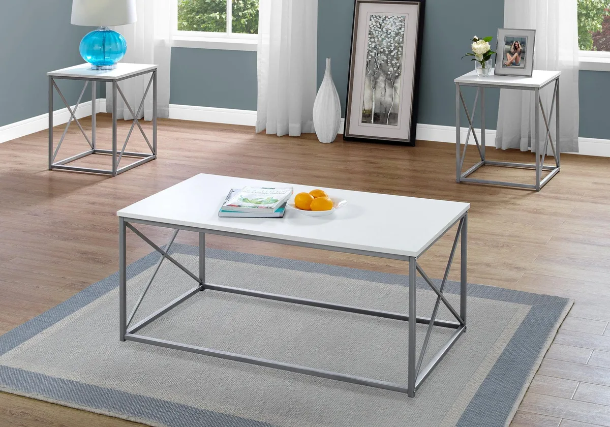 Three white laminate tables with grey X-frame metal legs, one rectangular coffee table and two square end tables