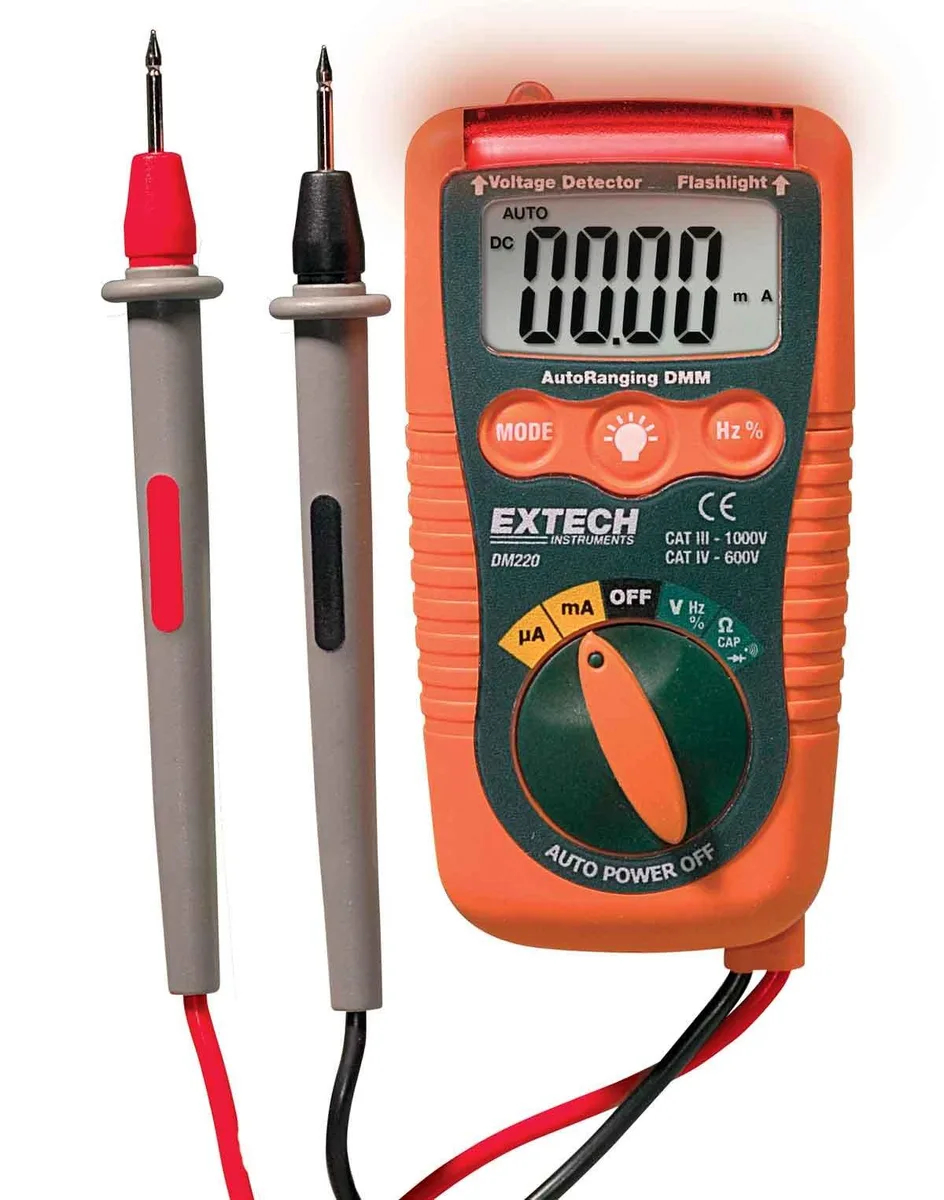 Compact digital multimeter with backlit LCD display and test leads