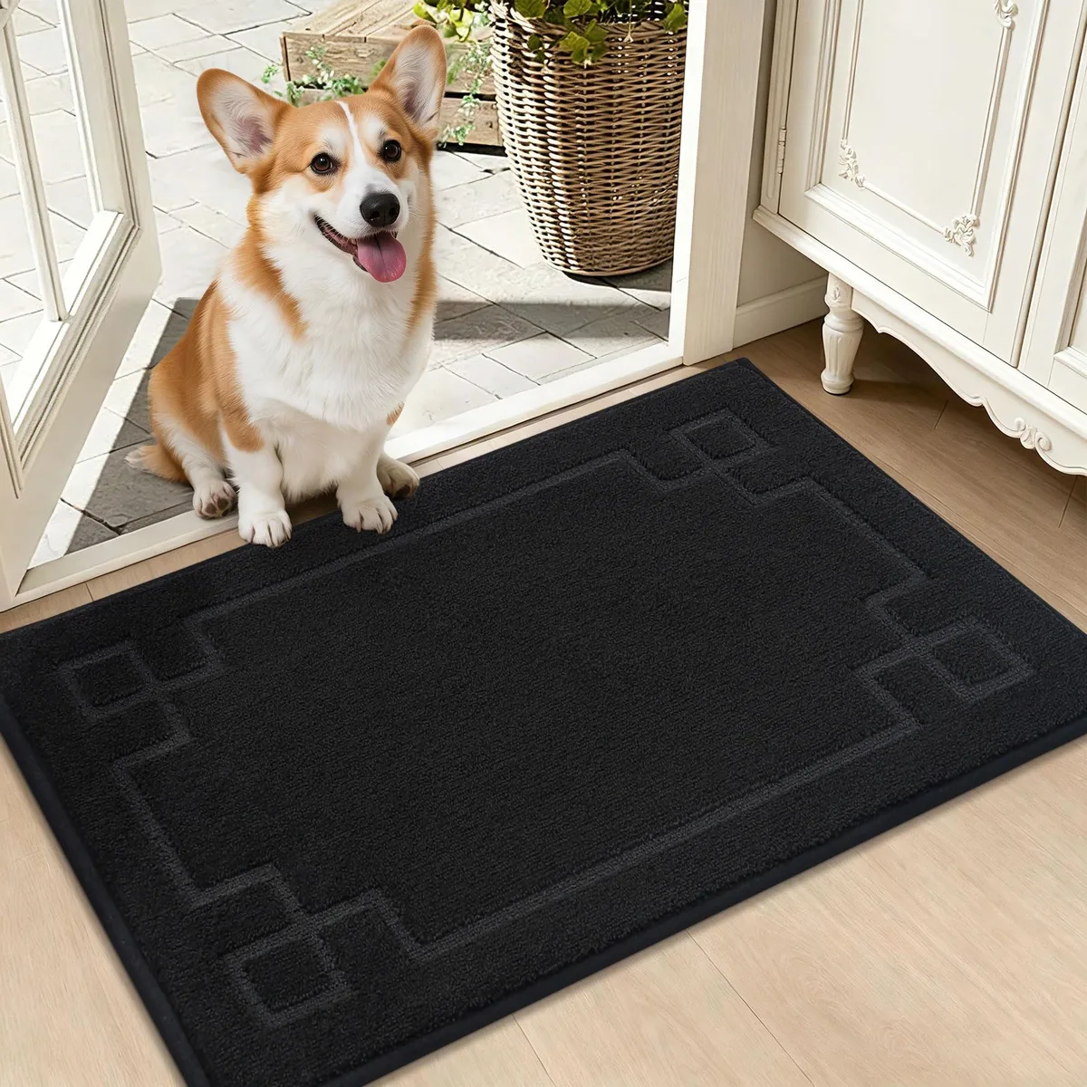 Black rectangular door mat with striped texture and low-profile edges