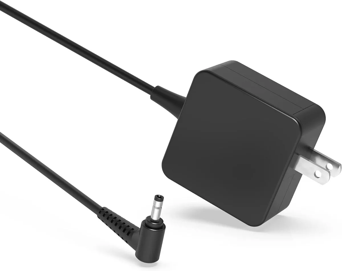 Compact black laptop power adapter with round tip connector