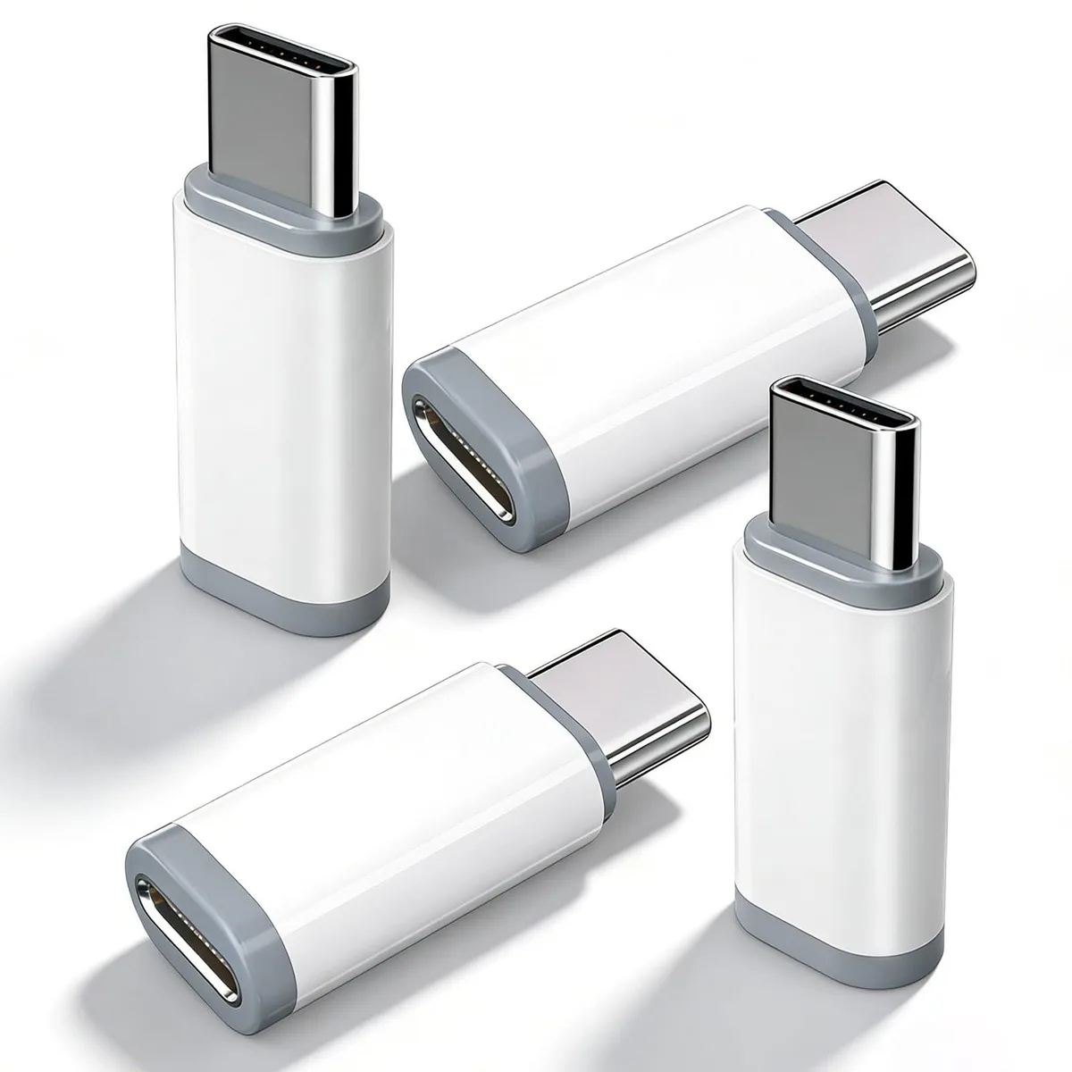 Four white Lightning to USB-C adapters, compact aluminium finish
