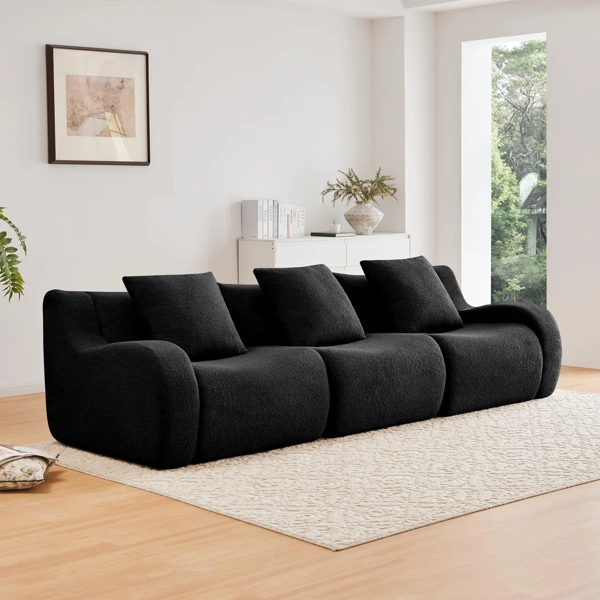 Black three-seater teddy fabric sofa with curved armrests and anti-slip base
