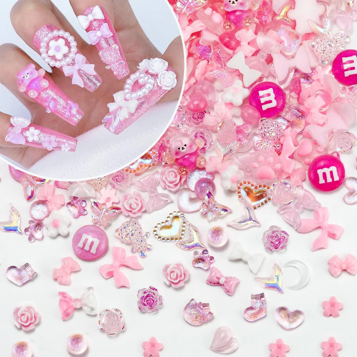 Clear bag holding about 320 tiny pink resin charms shaped like hearts, bows, flowers, butterflies and other kawaii motifs