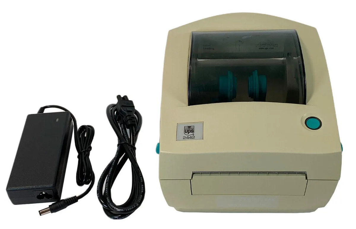 Compact desktop barcode printer in grey plastic with front label slot and rear parallel and serial ports