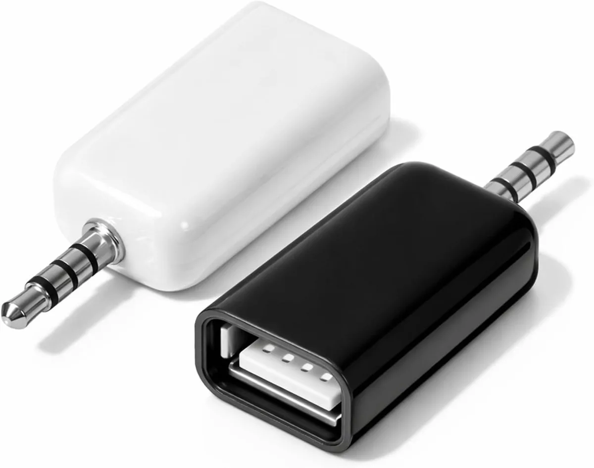 Two small USB-to-3.5 mm adapters, black plastic bodies, gold-plated plugs, 1.4 by 8.4 by 15.7 cm
